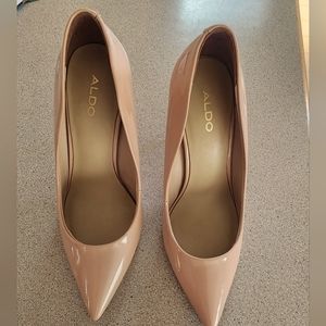 Tan patent leather pumps